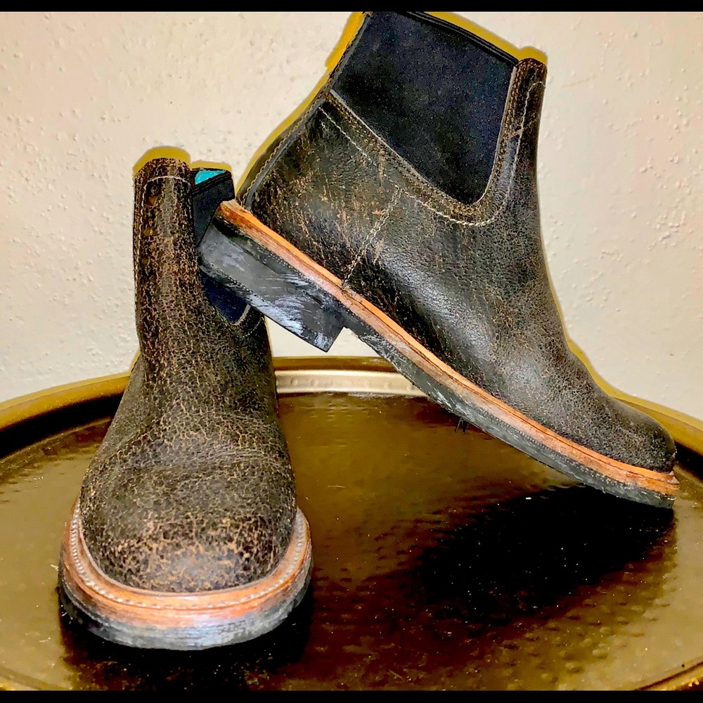 These boots are new and have been worn only once. The look is intentional.